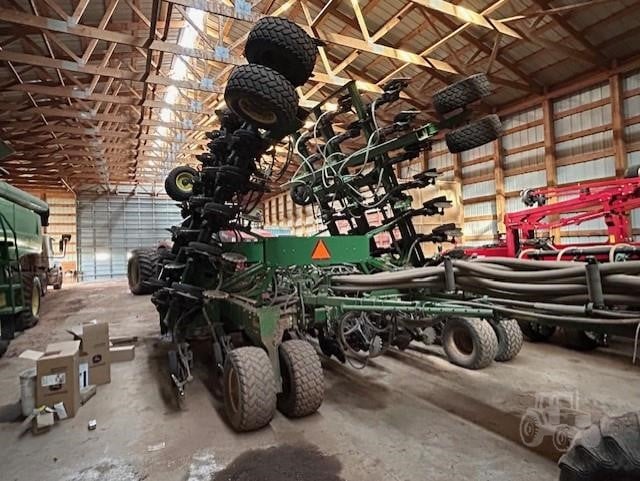 2009 John Deere 1895 seeding equipment on a farm field