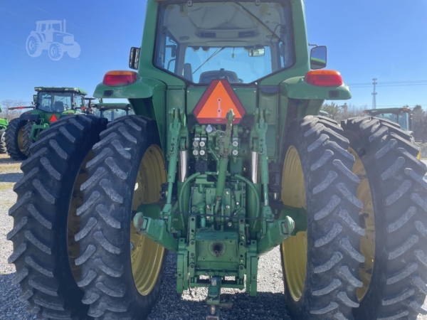 2009 John Deere 7430 Premium parked on a farm field