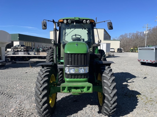 2009 John Deere 7430 Premium parked on a farm field