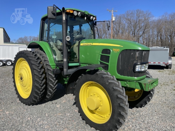 2009 John Deere 7430 Premium parked on a farm field