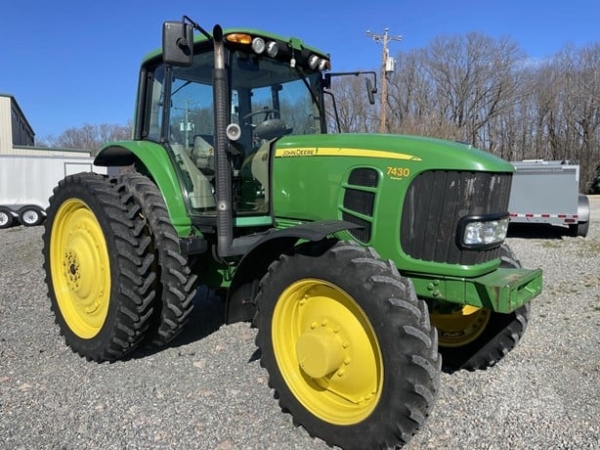 2009 John Deere 7430 Premium parked on a farm field