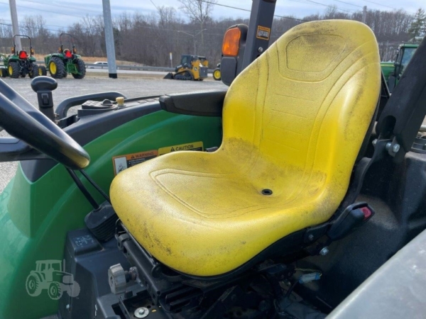 2015 John Deere 4044R tractor in action on the field